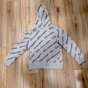 grey and black champion sweatshirt, with logo scattered everywhere. youth small